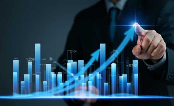businessman pointing at a digital graph and arrows with an upward trend, business growth, data analysis, and financial investments performance. statistics, market trends development