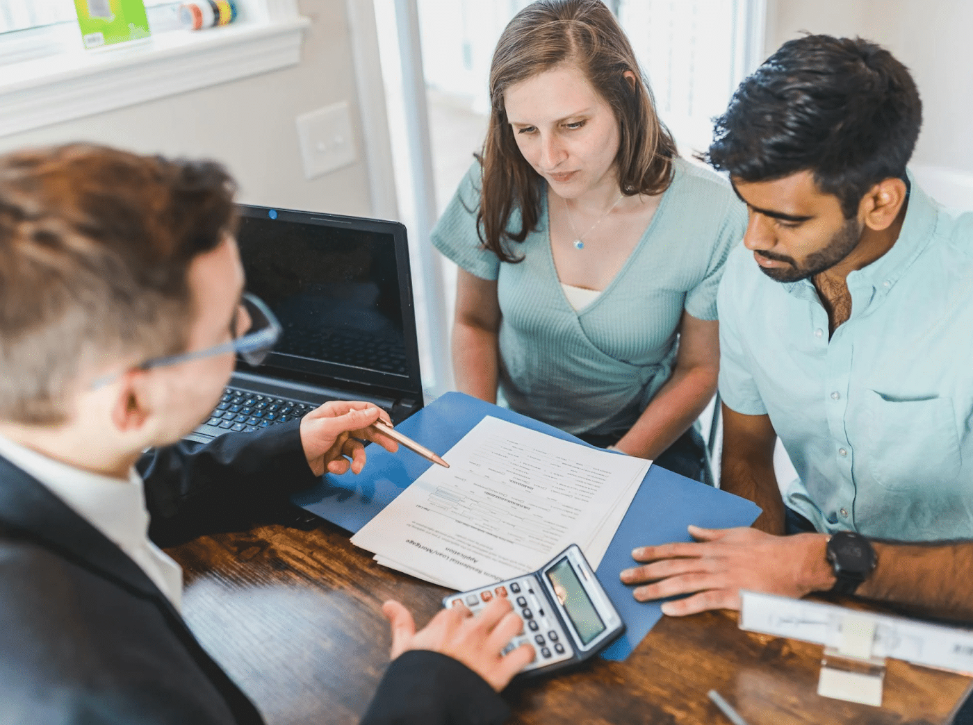 A couple talking about potential investments with an expert